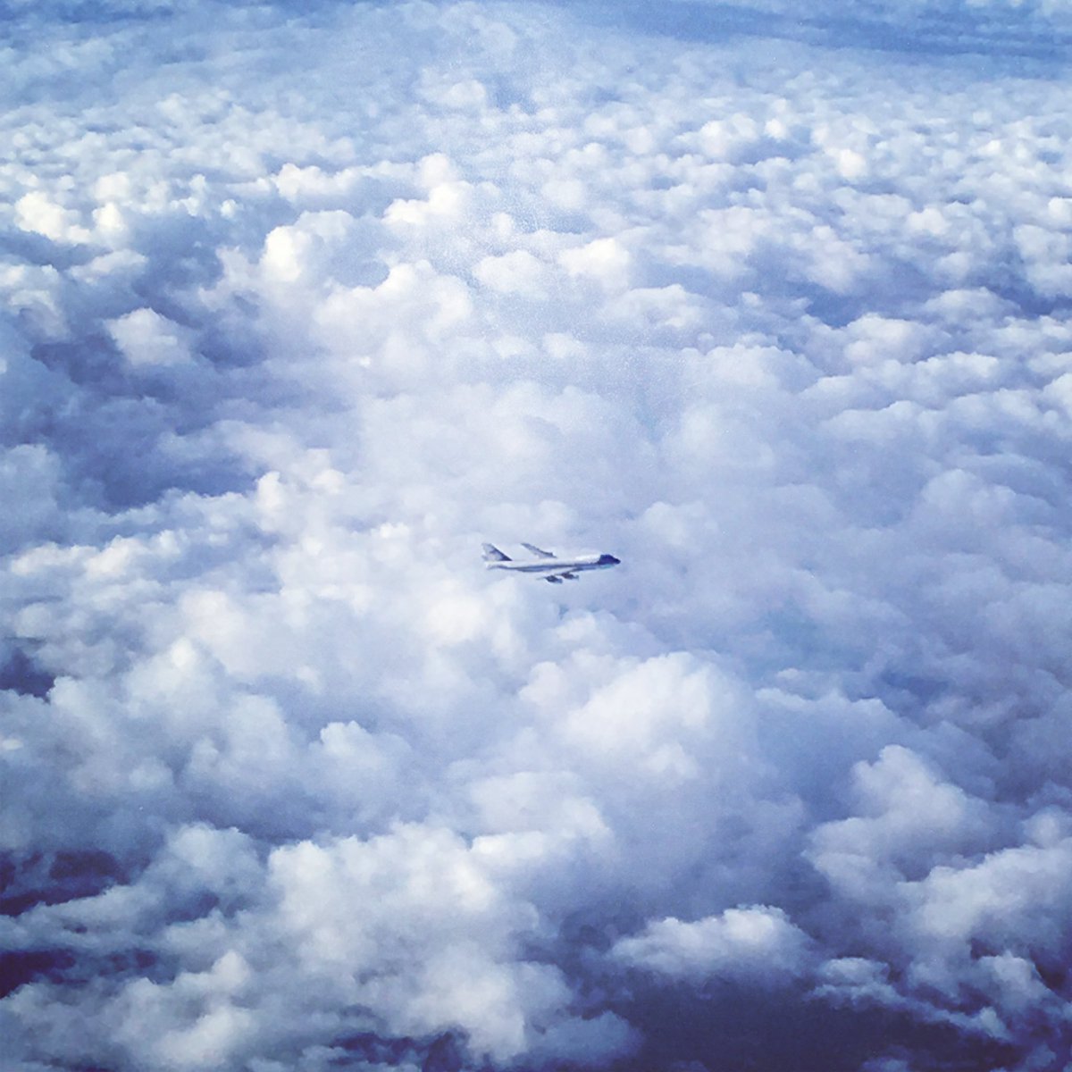 The Collector’s Edition of my book features my photographs of the world around me. 

I shot this fascinating image en route to China for an official U.S. state visit.  I recall glancing out the window and seeing the second Air Force One flying closely beside us - A steadfast