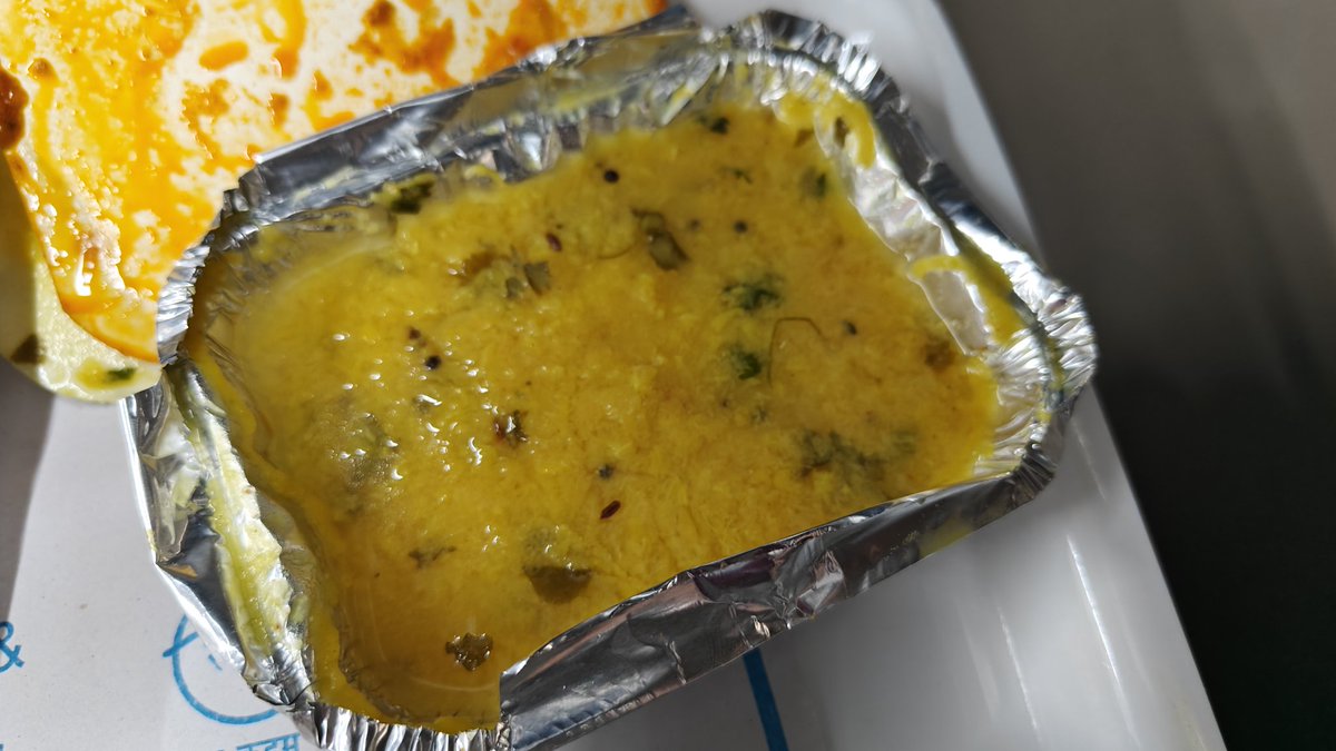 ChinmaySati's tweet photo. @RailMinIndia @IRCTCofficial @AshwiniVaishnaw 
I was so excited to travel in Vande Bharat today, until this happened: 
- People in the coach were served spoilt dal. Some even complained to the attendant, who told us the person responsible would be fined upto 25k. Credibility? https://t.co/cxOLiZhlMT