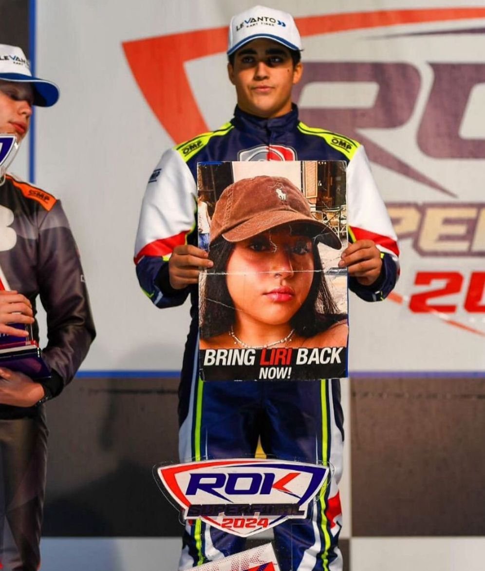 Brightmind_ME's tweet photo. Instead of waving the trophy, he waved a picture of his sister who is still held captive in Gaza. Guy Albag, brother of the Israeli hostage Liri Albag, won second place in the World Karting Championship yesterday and dedicated the trophy to her. 

Liri must come home! https://t.co/H7mWmDmdTa