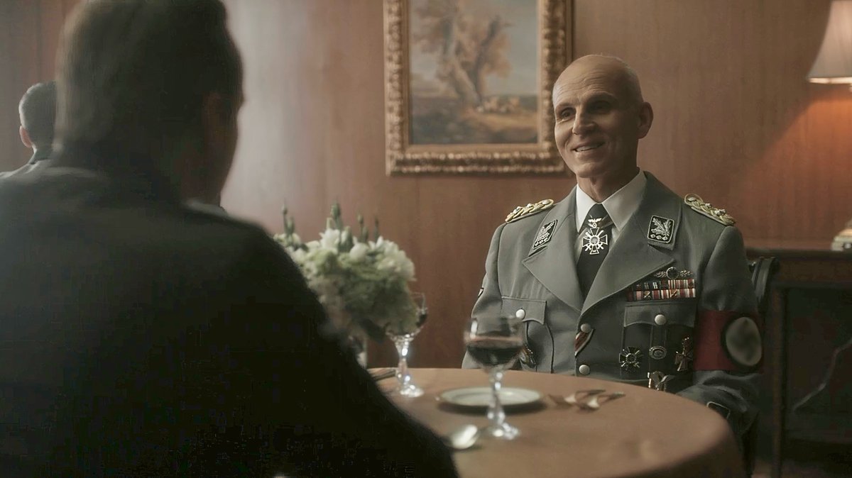 DividingByZer0s's tweet photo. S1E9.  Rudolph (who was recently outed as a double agent) has lunch with Heydrich.

[Rudolph, tasting wine]: “Interesting interrogation technique.  Do you intend to kill me with kindness?”

[Heydrich, smiling]: “Not with kindness.”

#HighCastle #ManInTheHighCastle #TMitHC #RudolphWegener #ReinhardHeydrich #Kindness