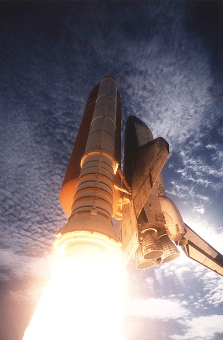 A view of the Space Shuttle Columbia (STS-73) shining against a deep blue sky moments after launch on October 20, 1995. Onboard the orbiter is the United States Microgravity Laboratory 2 (USML-2).