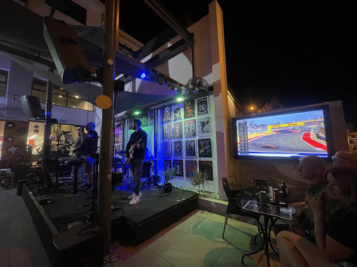 GlenDoc's tweet photo. Watching #F1 while a band plays next to the TV in Cyprus! #WayToLive #COTA https://t.co/RNUn5ryHUa
