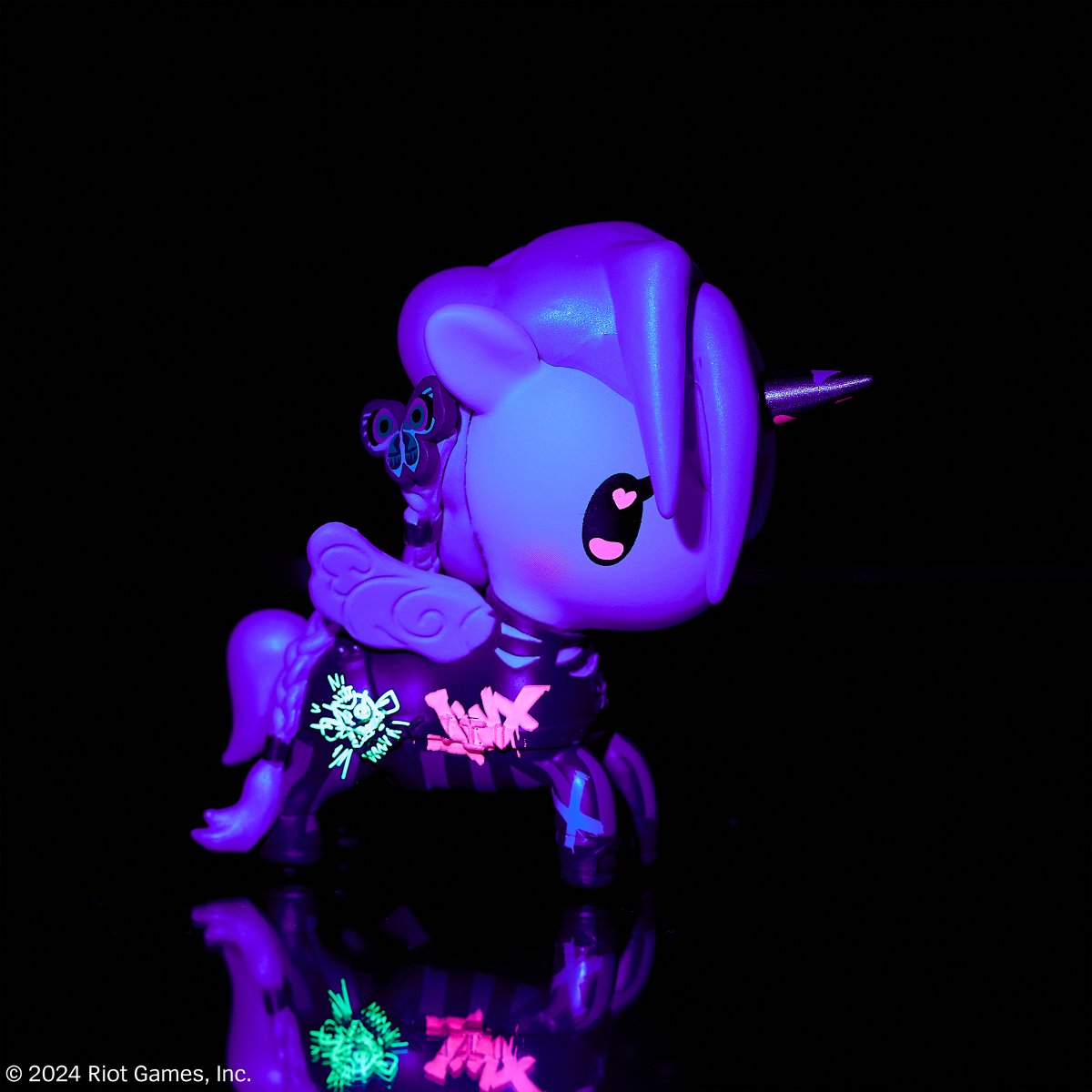 tokidoki's tweet photo. Get ready to paint the town blue with the #tokidoki x #Arcane League of Legends Unicorno Special Edition Jinx! 💙 Flash a black light on Jinx to see some glowing graffiti magic! https://t.co/nqIfLBh9D8