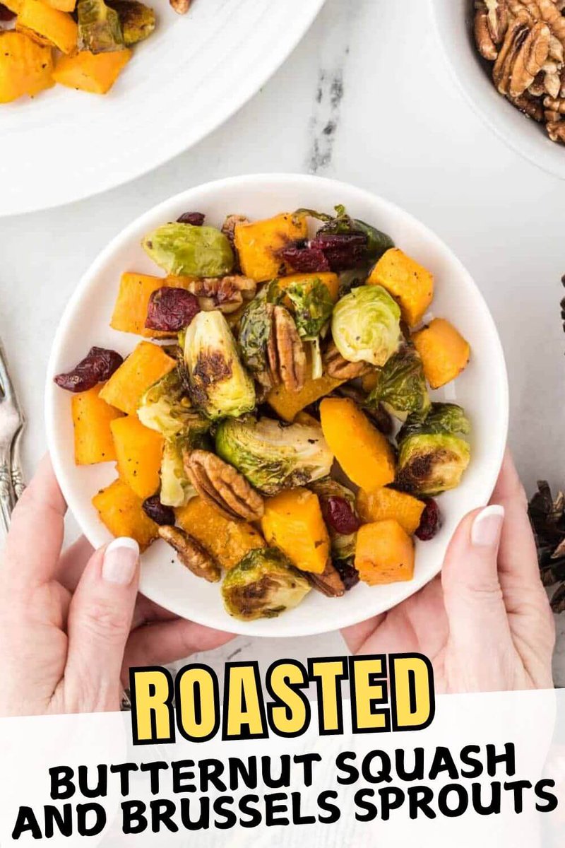 Butternut Squash and Brussels Sprouts with cranberries and pecans. Easy to make roasted with Italian seasoning mix for tons of flavor. It's a great dish for your holiday table! #brusselssprouts #roastedbutternutsquash #roastedvegetables #bowlmeover  bowl-me-over.com/roasted-butter…