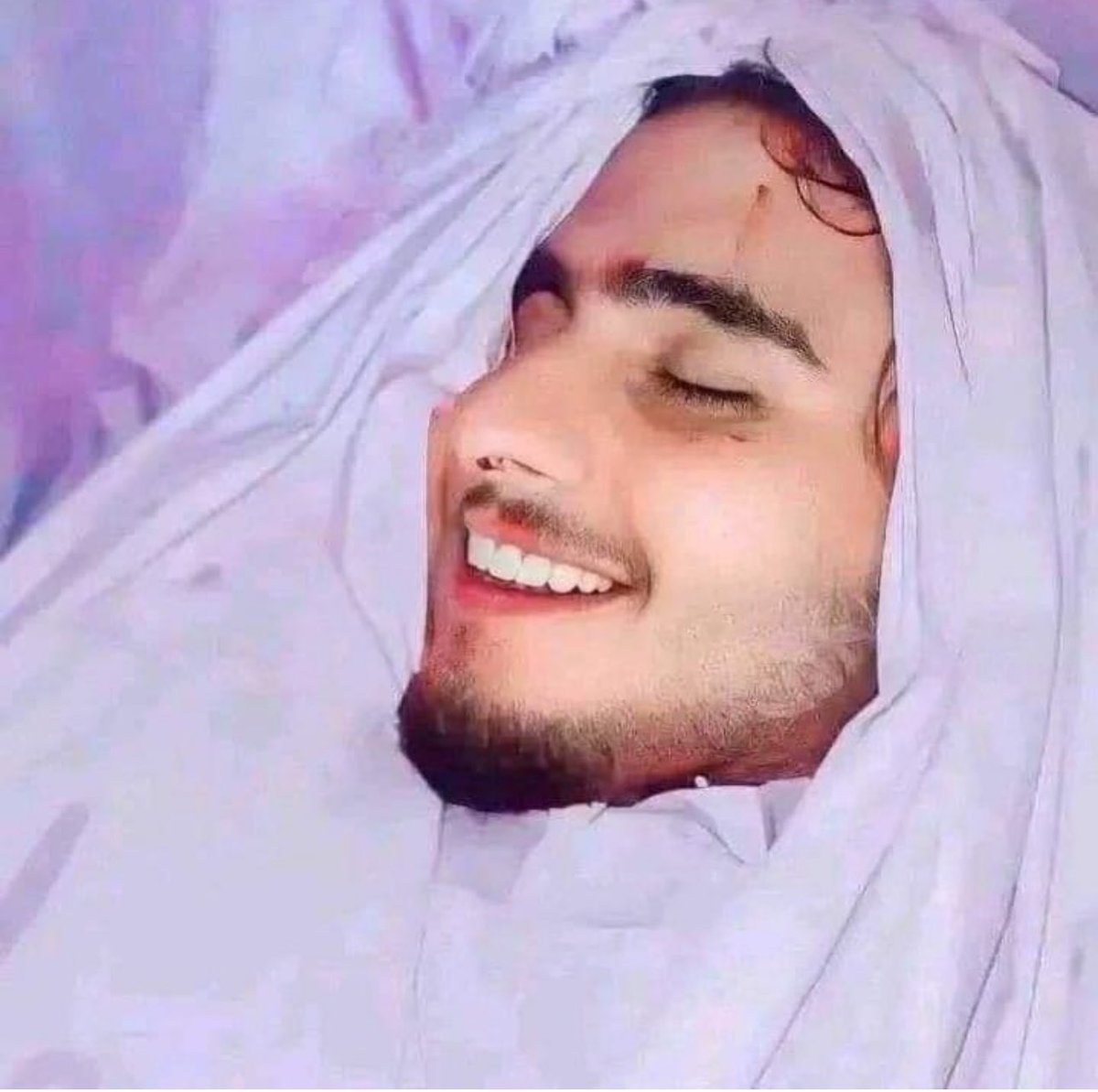 A Martyr  smiles before he is buried. Allah bless him and his family and all those who are unjustly targeted. 

Click this link to help their families launchgood.com/lebanonomaa