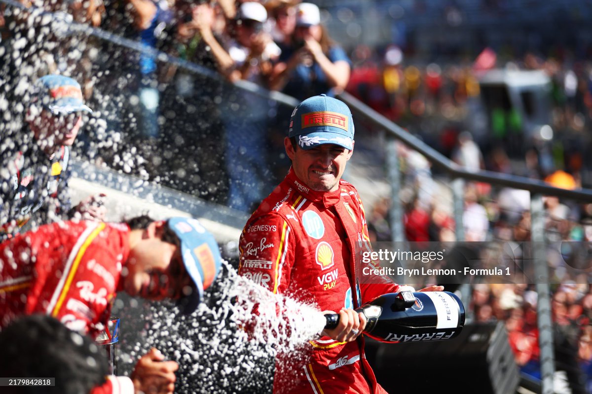 GettySport's tweet photo. Race winner Charles Leclerc of Monaco and Ferrari celebrates on the podium after the F1 Grand Prix of United States at Circuit of The Americas in Austin, Texas. 📸: @BrynLennon - @F1, Peter Fox - F1, @ChrisGraythen, @snapper_thommo #F1 #USGP https://t.co/6XYRyEYj0l
