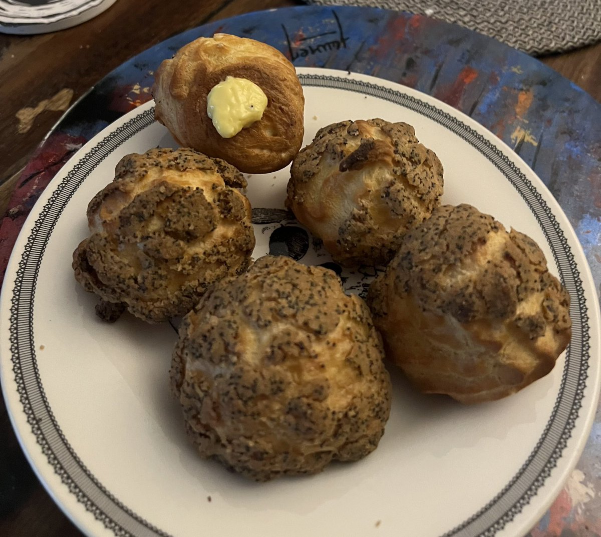 Been watching too much British BakeOff. These are choux, filled with lemon curd and  topped with poppy-seed craquelin. #bakeoff