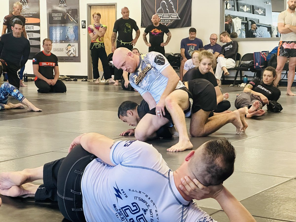 aliveness_ape's tweet photo. Another great day at SBG Fall Camp 2024. 🦍

Our Sunday morning started off with a bang as old-school SBG coach, @ChrisConolley took the entire room through some excellent MMA skills and drills. Particular emphasis was paid to takedowns against, and away from the cage/wall. His knowledge and understanding of the game is second to none. 

That section was followed by @SBGidaho coach, Jesse Brock. Jesse is one of the best black belts in the world when it comes to blending wrestling and Jiu-Jitsu, and his defense series against the single leg showed that. 

Our day ended with SBG SoCal head coach, Marco Sanchez. One of our younger head coaches, Marco brought enthusiasm, as well as great material, with a focus on connection and standing weight distribution for takedowns, as well as standing chokes. 

As always, everyone heads home with notebooks full of new material, better skills then they had before they walked in this weekend, and great memories with new friends. And at the end of the day, that’s what it’s all about. 

Look for our next big camp, SBG’s annual Spring Camp 2025, with dates and location to be announced soon. I’ll see you there! 🦍🙌🏻