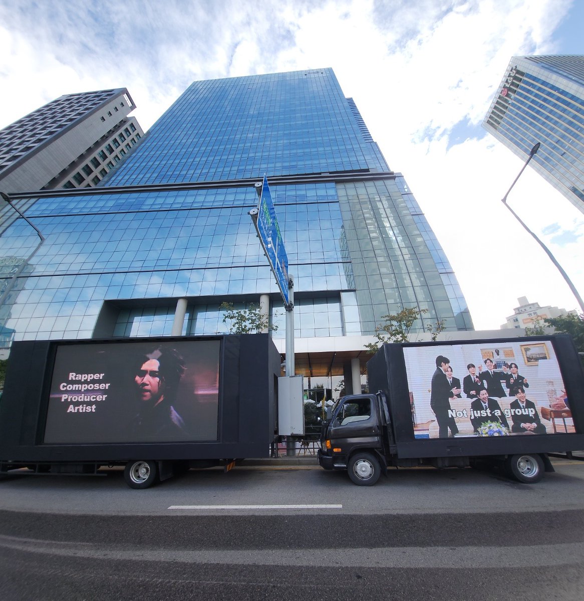 minpiku_'s tweet photo. Russian Armys and Brazil Armys also sent trucks for Yoongi infront of HYBE today. There are a total of 4 trucks cheering for Yoongi and BTS infront of HYBE today.

So grateful to everyone for arranging the projects.
#BTSİsSeven 
#btsis7
#WELOVEYOONGI 
#YoongiNeverWalksAlon https://t.co/ryWGzvNcGH