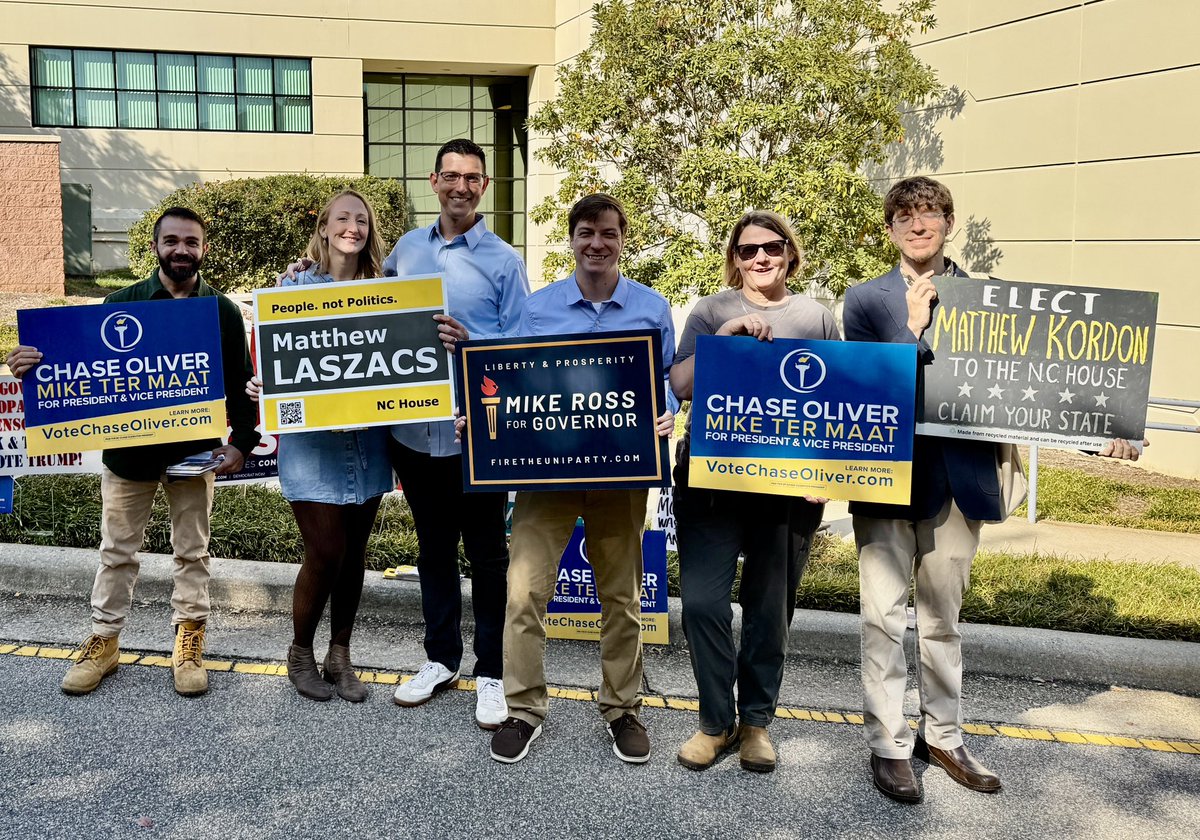 I voted Saturday, and was privileged to have <a href="/ChaseForLiberty/">Chase Oliver</a> waiting for me outside the poll, so I got a sort of #ballotselfie inception thing going on here 🥰 Several great <a href="/WakeLP/">Wake County Libertarian Party</a> candidates and supporters here, including <a href="/Kordon4Liberty/">Candidate M. Kordon</a> , Nick Dioguardi, <a href="/Matthew4NC/">Matthew Laszacs</a> (+1;