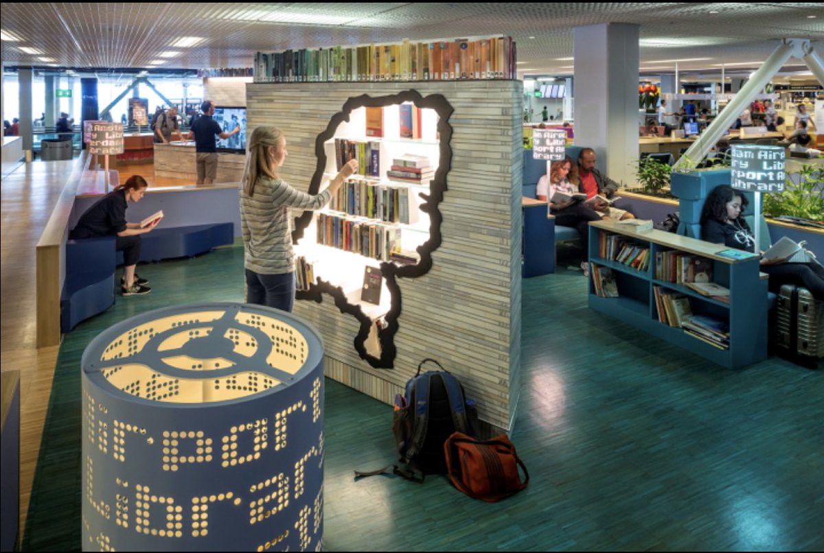 WorldAirSociety's tweet photo. The #Airport #Library at @Schiphol is the world’s first, located on the Holland Boulevard after security. It has 500+ #books of Dutch literature classics, history &amp; children’s literature. It also a spot where travelers can donate or ate a book. #avgeek 
Photo: Schiphol Airport https://t.co/8RDLSHq7no