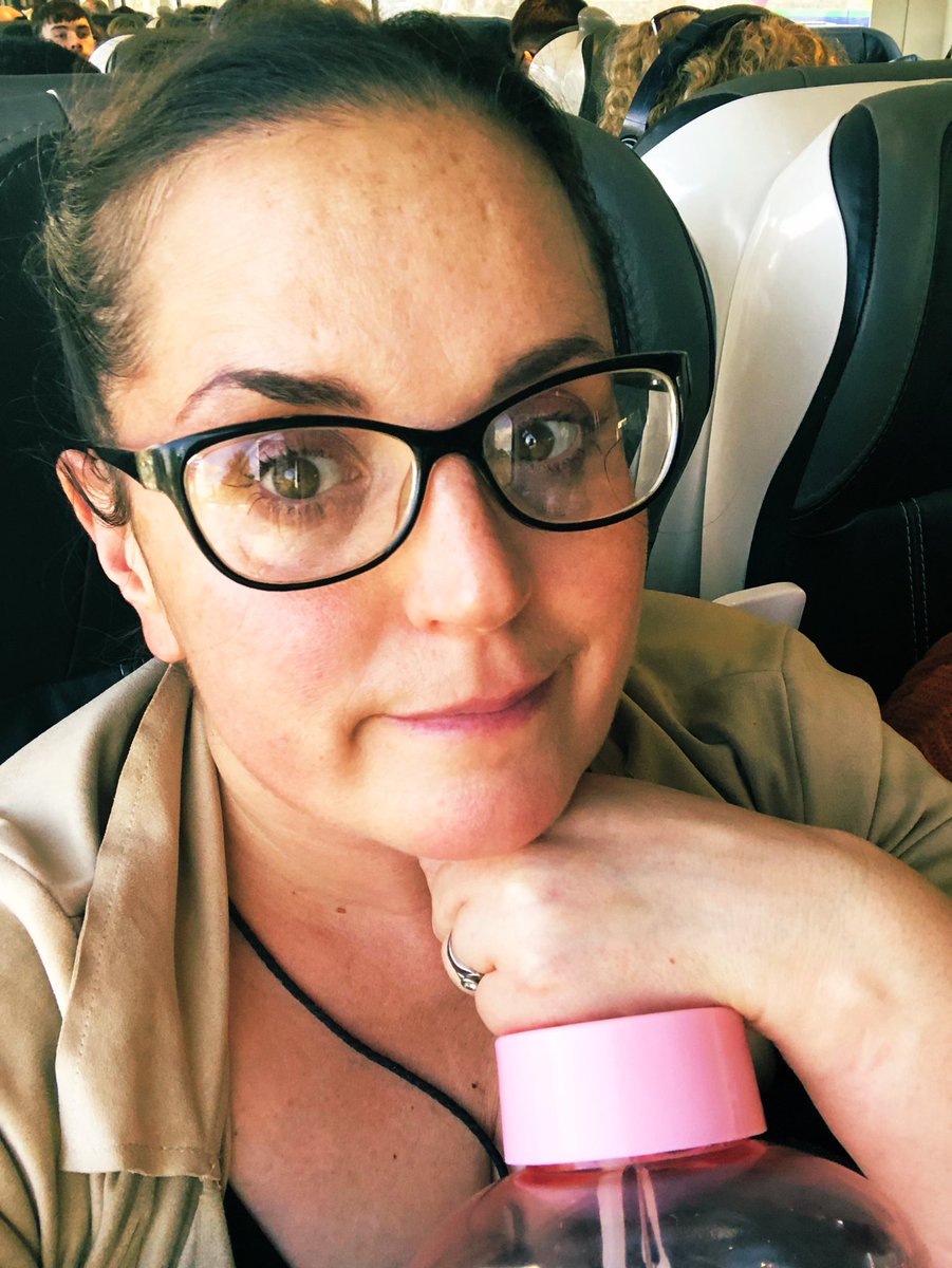 AshiLockie's tweet photo. Just a tired-happy author on the train home from chatting to the wonderful 3rd Years @WellReadFoxrock’s brilliant Reader’s &amp; Writer’s week! Fell in love with the spooky Dark Acadmemia display on the library desk, complete with old newspaper reports on yellow d paper! Need one 😍 https://t.co/tCN8Lgeb2E