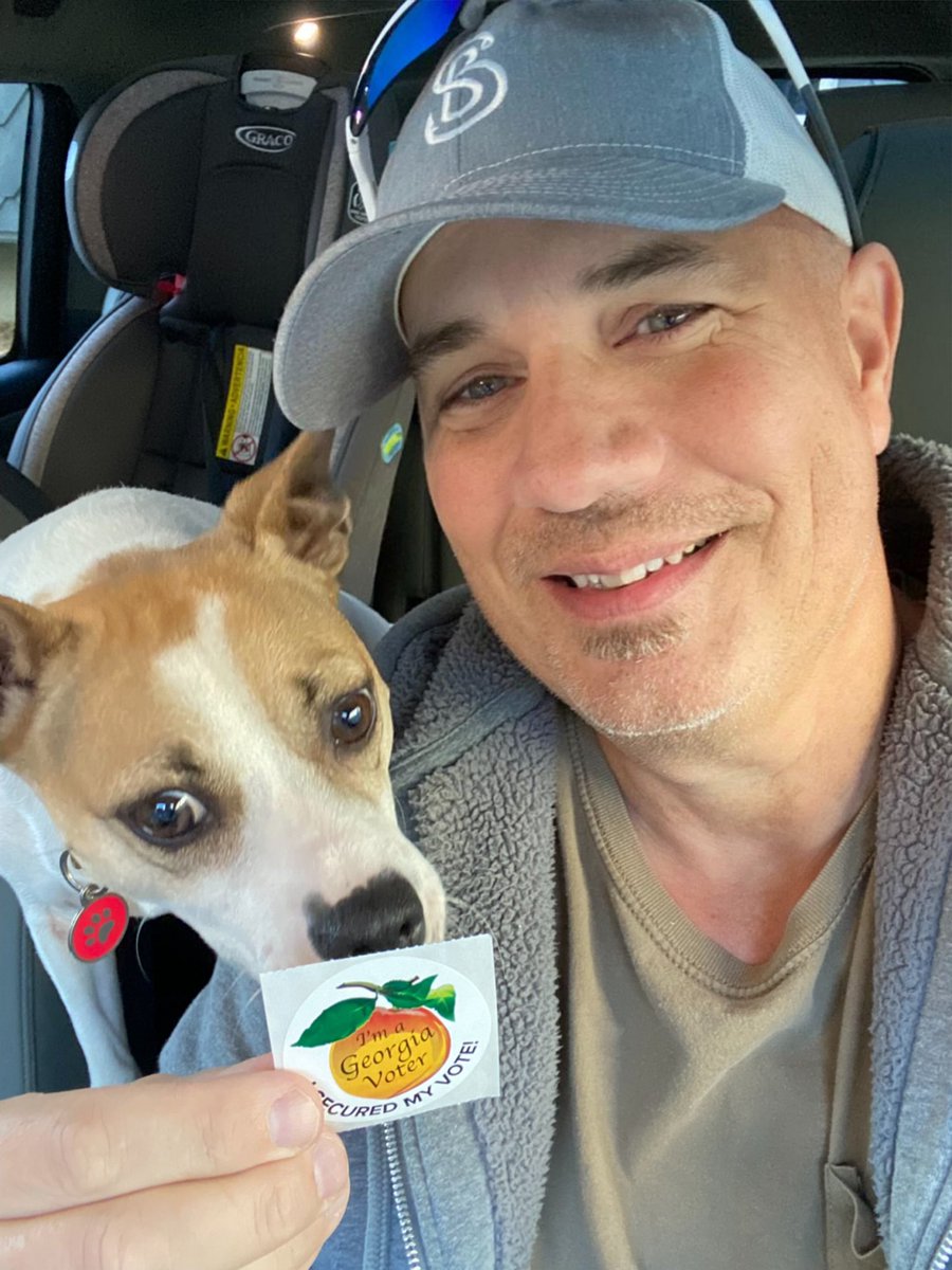 bywillpollock's tweet photo. best way to vote is listening to @StephMillerShow with @cliffschecter in the car and then snapping a selfie with the pup 🐶 #HarrisWalz2024 #SexyLiberal #GeorgiaIsHarrisCountry #GeorgiaVotesBlue https://t.co/dJInPNk9VJ
