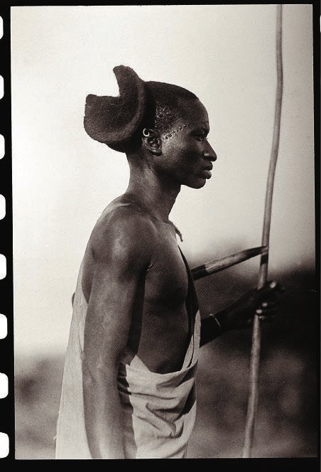 sankoaaaa's tweet photo. The hair, incorporating Chinyanja (Zambian/Mozambican language); the colour scheme. He's in his African era. This is gonna be generational work! https://t.co/t6wx9QHxO2
