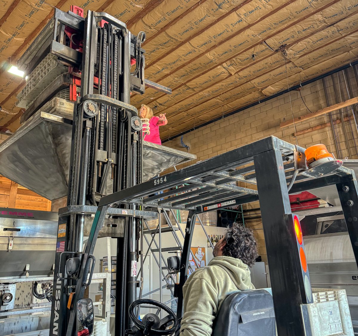 ampeloscellars's tweet photo. Time to crush and our dream-team kicks in.  Jesse drives the forklift, Rebecca guides him to rotate the bins, Matt will reload bins, control the stem bins, replace the full fermenters with new ones and prepare them to get back into the cold room and I check and organize it all. https://t.co/gsF8Bbru3R