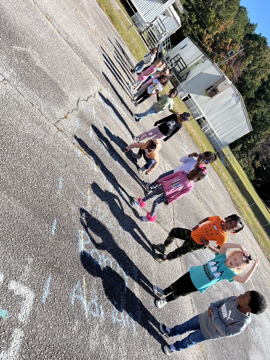 mcfrarey's tweet photo. Week 6 in STREAMin3 has us exploring shadows! What a perfect fall day to go out and observe our shadows. We measured during small group (blue line) and made predictions if our shadows would get bigger or smaller then remeasured at recess (yellow line.) https://t.co/Y4pGTHq1Bb