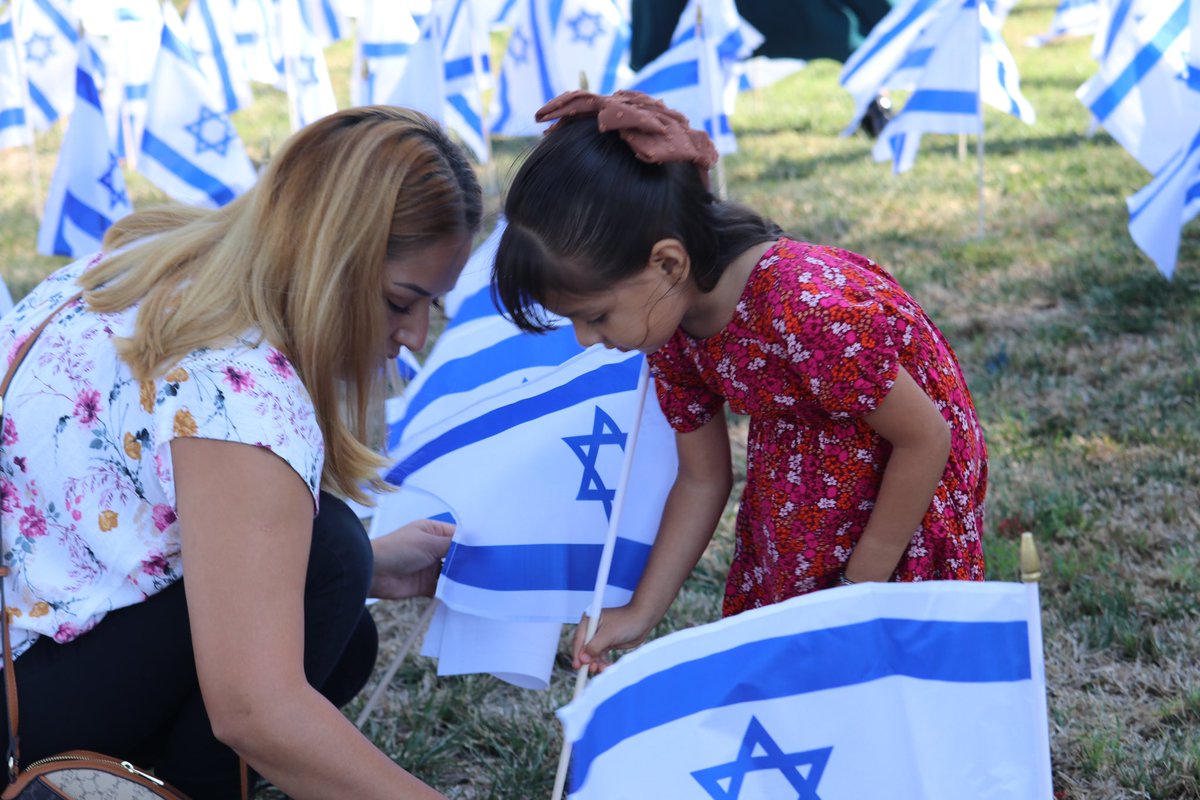IsraelinLA's tweet photo. On October 6th, the Word of Faith Center hosted ‘Flags of Fellowship’ to stand in solidarity with Israel and mark one year since the October 7th massacre. With 1,200 flags planted in front of the church, Jewish and Christian leaders shared the importance of supporting the State of Israel. This powerful event highlighted what we can achieve when we unite in support of one another and our homeland. Together, we stand against terror and in support of humanity, condemning the horrors of October 7th and embracing our shared values. #StandWithIsrael #FlagsofFellowship