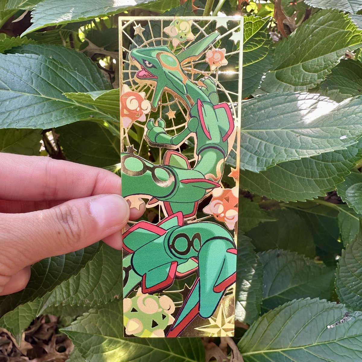 Our metal bookmarks have arrived! Each one is about 5x2 inches featuring  Rayquaza with a bunch of Minior. Design by @gggermicide