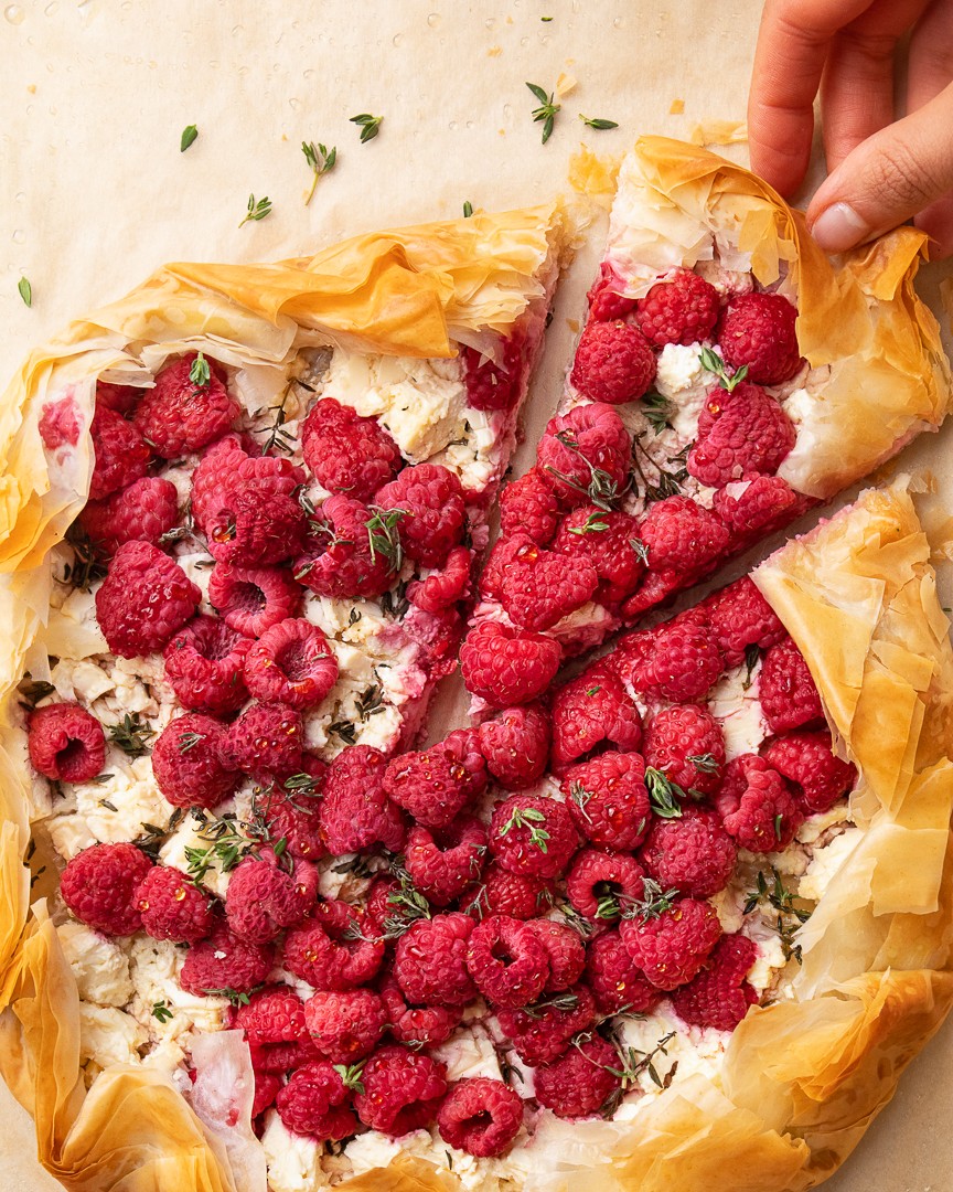 The flavors of fall mix &amp; mingle in this delicious savory galette! Crispy phyllo dough surrounds tangy feta cheese, a sprinkle of thyme &amp; a heap of juicy raspberries for a sweet-and-savory combination that takes dinnertime to the next level. Recipe here: driscolls.com/recipes/raspbe…