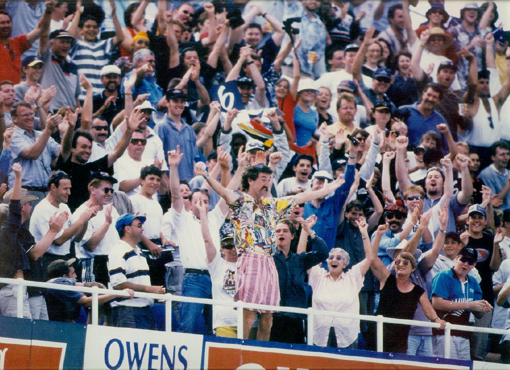 Like this crowd, we're going wild for the T20 World Cup-winning <a href="/WHITE_FERNS/">WHITE FERNS</a>! Congratulations! 🏏🏆

Photo: Crowd in the West Stand, Eden Park, Auckland, 20 February 1999. NZCM Collection.