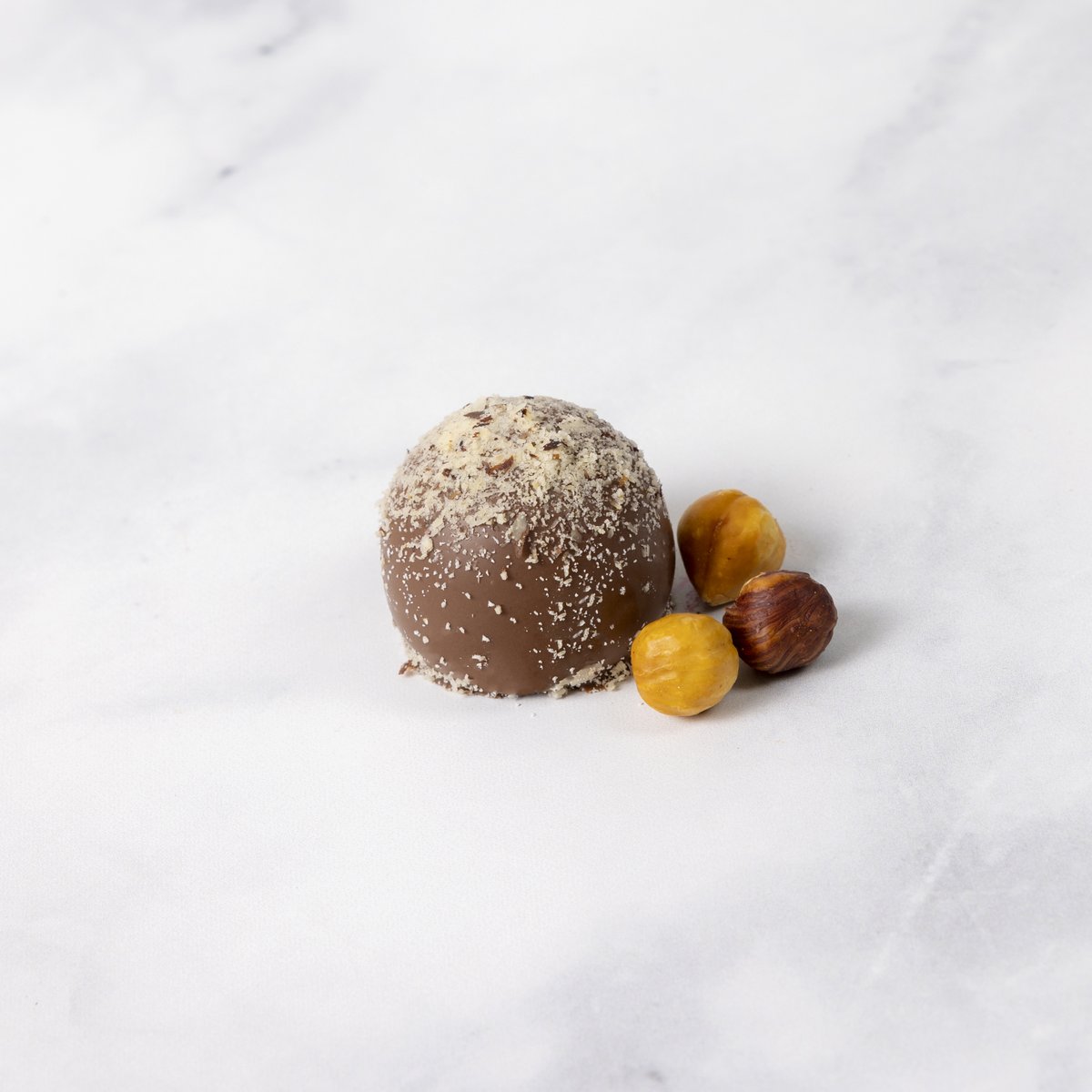 When "International Nut Day" falls on Truffle Tuesday...
It's cause to enjoy jewels like this lovely Hazelnut Truffle.
(If you needed another excuse) 😉

#FallFashion  #rockymountainchocolatefactory