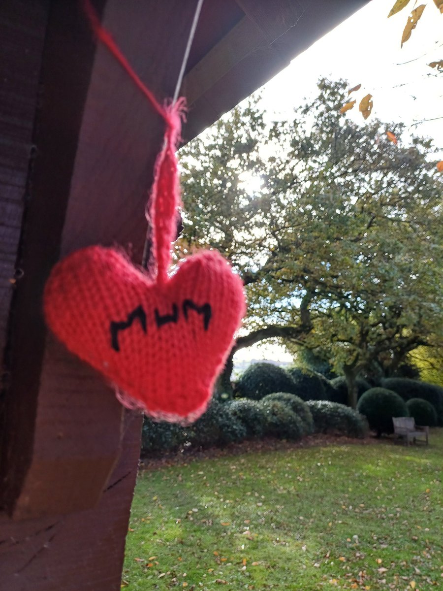 kendie's tweet image. Sitting having a coffee "with Mum". It warms my heart when I see her knitted heart is still here ❤️ #rememberingmum #dorothyclivegardens