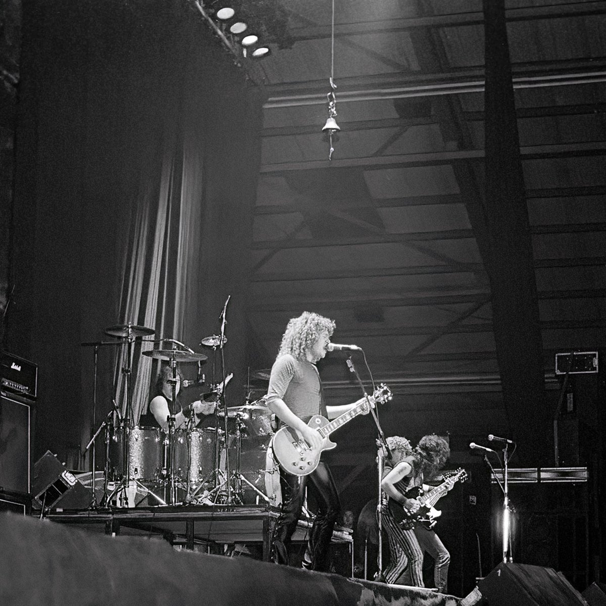 john_kinsale's tweet photo. "For those about to rock, we salute you!" 🎸⚡ Captured this iconic shot of AC/DC at the RDS Dublin in '82 while a student at Trinity College. Their legendary live shows, complete with cannon blasts and Hell’s Bell, were unforgettable. Rock history in the making! #ACDC #ForThoseAboutToRock #RDSDublin @ilfordphoto @rdsdublin @du_photos #TrinityCollegeDublin #LiveMusicMagic
