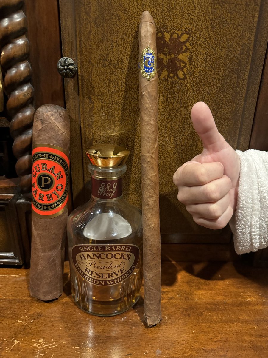 supercigardave's tweet photo. Letting my wife select my next cigar, as per my agreement with @Not_That_JB. This is unfolding as anticipated. The bottle of whisky is just for context. I turned down her first and second choices. This isn't going smoothly. #CigarFun #CigarLife https://t.co/jAnHOVLDd4