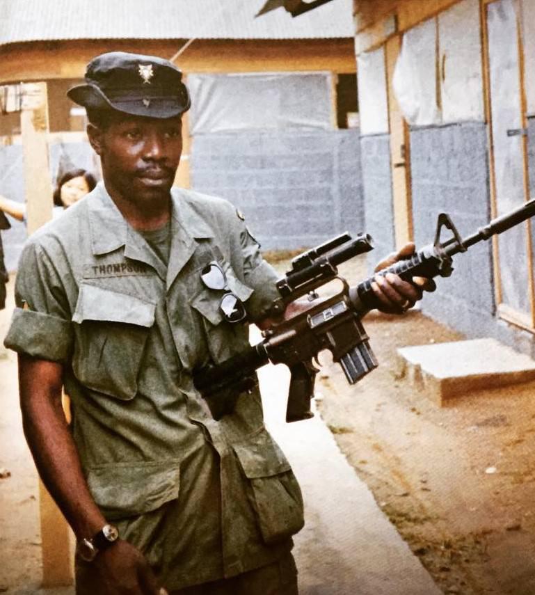 MACV SOG warrior Thompson with his very basic optic scope. Notice how the trigger guard has been removed. Dicey thing to do, but you can wear gloves while shooting. I was unaware until recently that this was only a screw holding the guard in place.