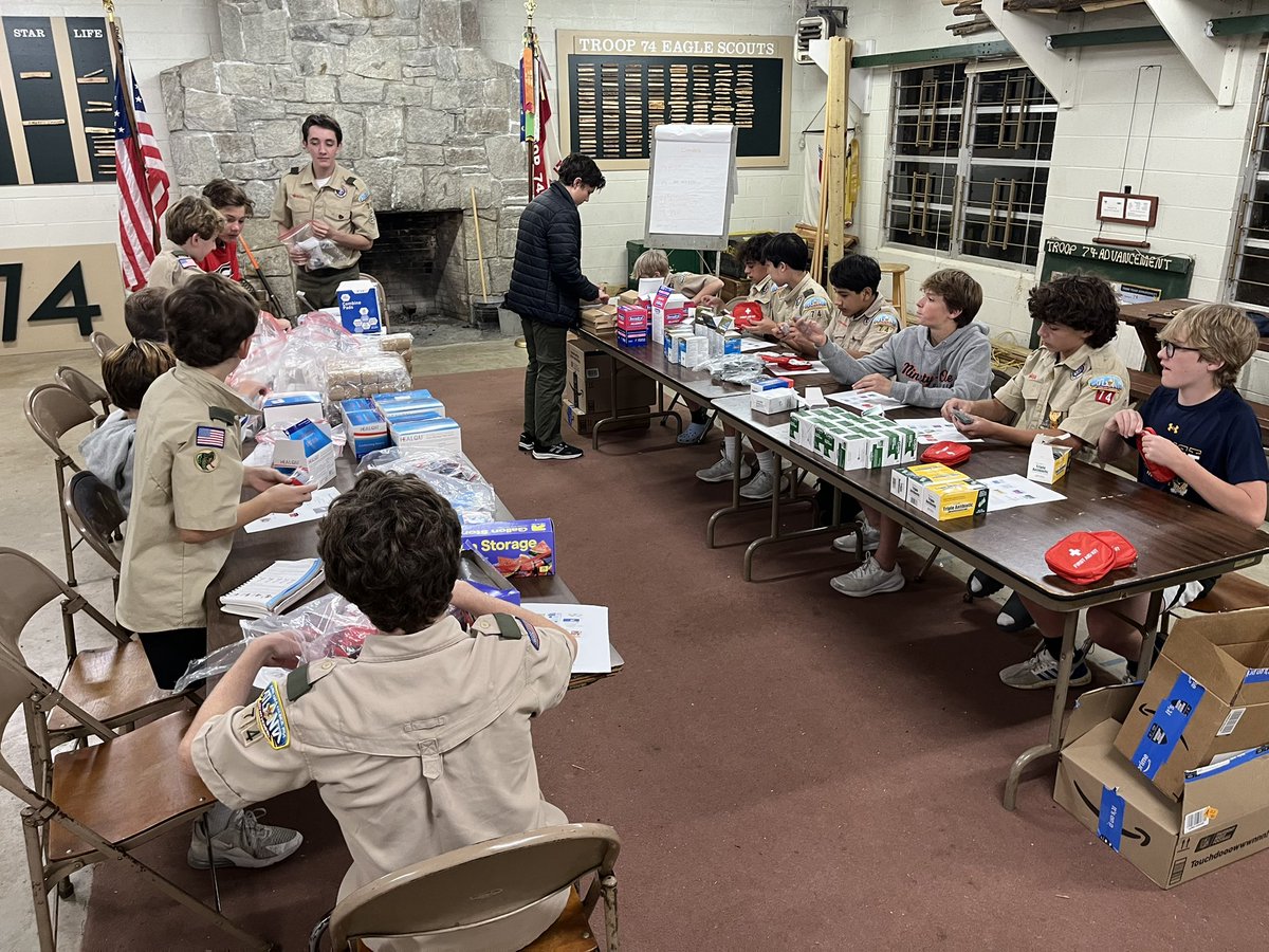 Scouts working on putting together First Aid kits for St Vincent de Paul