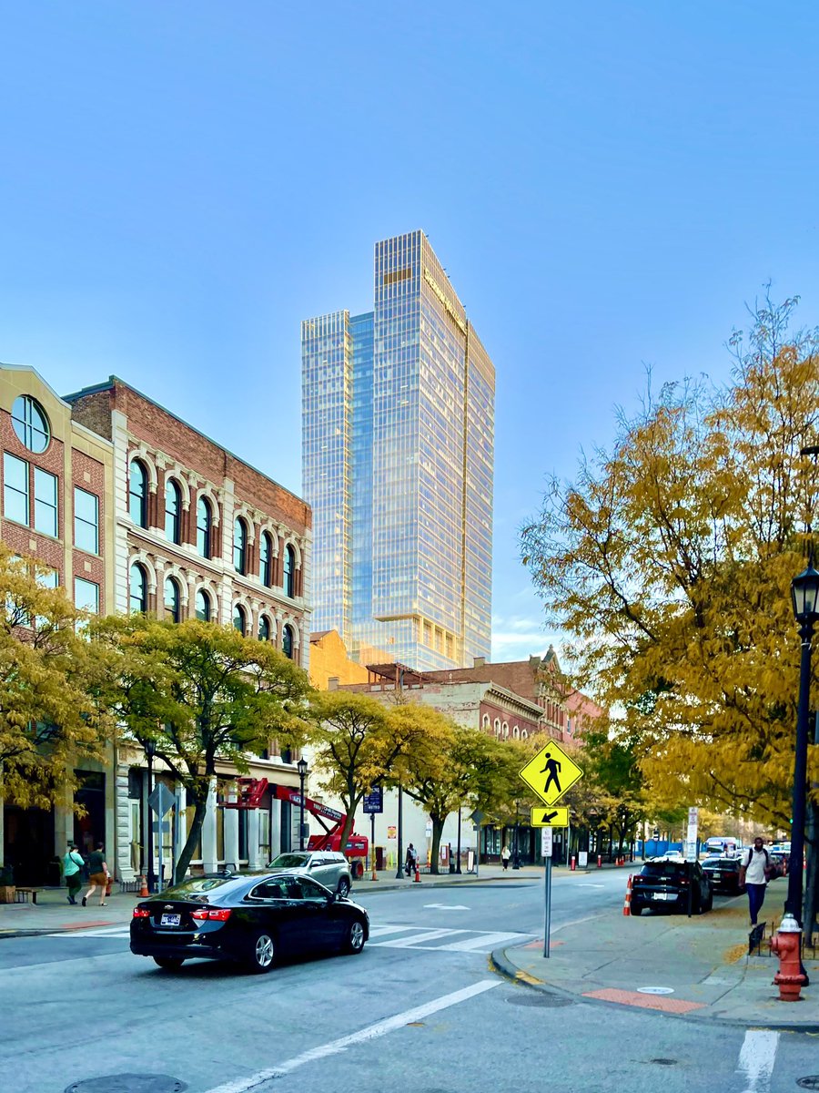 DowntownCLE's tweet photo. Here’s a beautiful Warehouse Wednesday fall view from West 6th Street! 💛 With changing leaves, historic architecture, local businesses, and a glimpse of the new Sherwin-Williams tower, we love enjoying a stroll through downtown’s scenic streets like this one.🍂 https://t.co/EJewWfTHKU