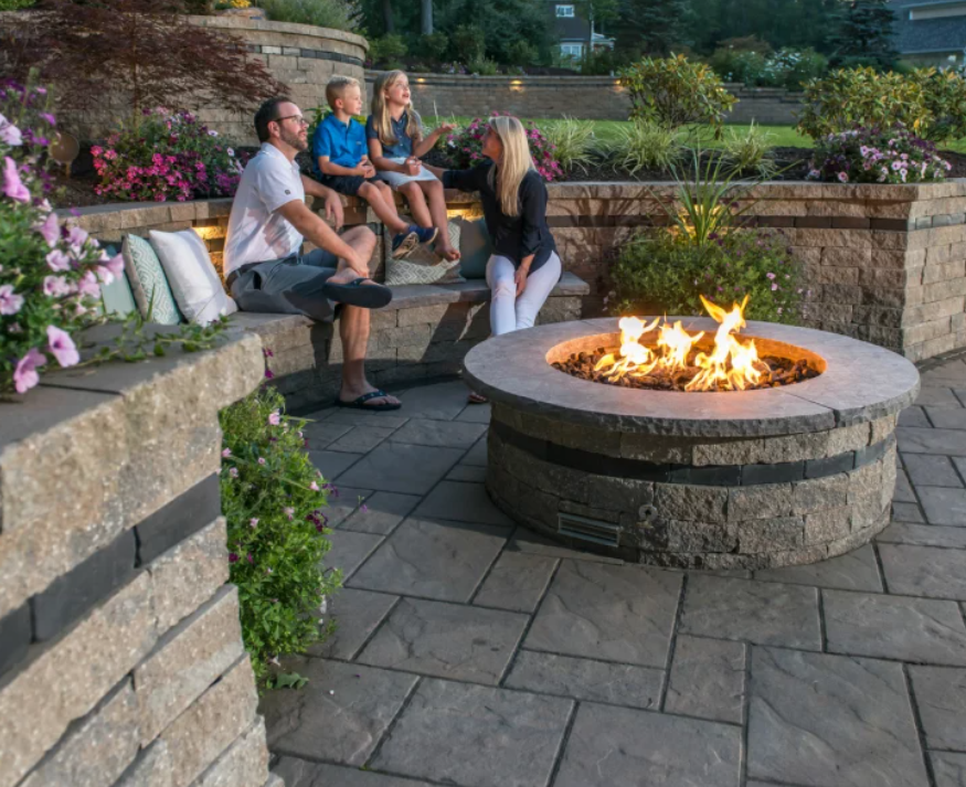 rocksnroots's tweet image. DESIGN CONSIDERATIONS FOR INCORPORATING A FIRE PIT INTO YOUR BACKYARD PATIO   Consider positioning your fire pit close to a nearby garden wall &amp;amp; add plush cushions or pillows to turn your garden wall into an additional space for seating. #unilock #firepitdesign #backyard #outdoor