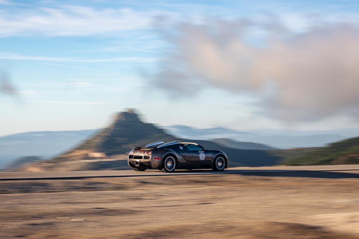 Bugatti's tweet photo. BUGATTI’s W16 creations weave through the stunning, rocky landscapes of Morocco – a unique experience.

#BUGATTI #BUGATTIGrandTour #BUGATTIGrandTourMorocco
–
https://t.co/mCEE0ghyaw https://t.co/MWC1fYML8l