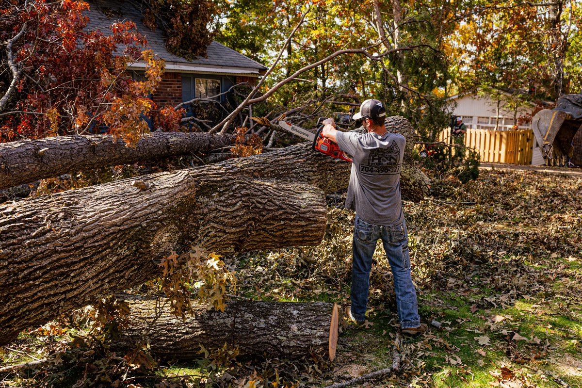 SavageFreedoms's tweet photo. Edward Funderburk. 101st Airborne Veteran. Severe tree damage to his home in Asheville three weeks ago during #HurricaneHelene. Today, @USArmy National Guard personnel and #SavageFreedomsReliefOperations volunteers showed up with tools in hand and love in their hearts. This is what America First looks like.