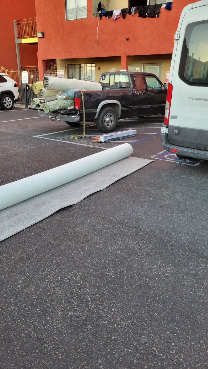 That's right, they are doing carpets in the parking lot behind our van.