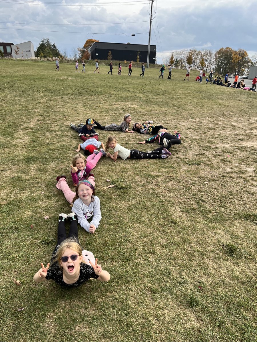 Exploring literacy outdoors on TAKE ME OUTSIDE DAY included making letters &amp; words with found items in nature and/or with our bodies. Great participation by all involved!