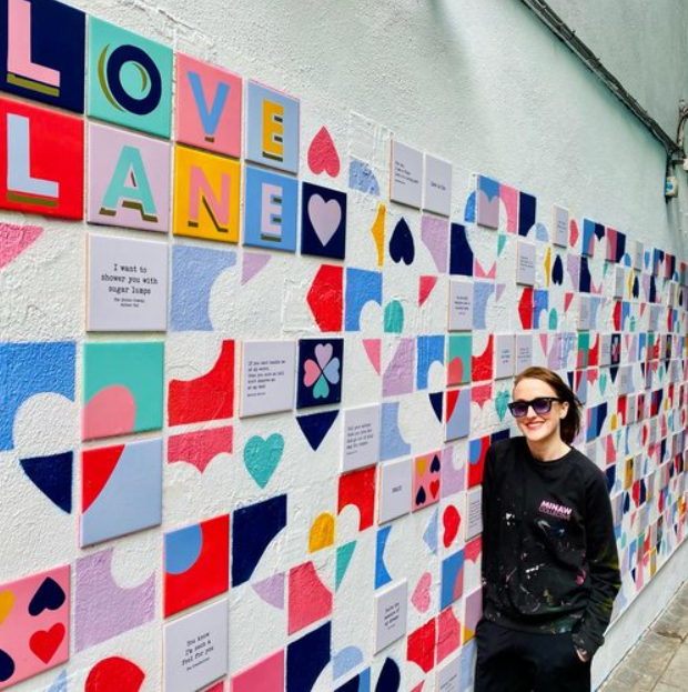 DubCityCouncil's tweet photo. The South East Area office is working with Artist Anna Doran who is going to renew her ‘Love Lane’ installation in Crampton Court in Temple Bar early next year. The lane is a tiled installation with quotes, lyrics, poetry and dedications about love and is a very popular piece with Dubliners and tourists.
Anna is looking for your help, if you have any quotes/lyrics/poems or dedications about love or a loved one, please DM her on her Instagram at @anna__doran before the 5th November as Anna is aiming to have the wall fully re-tiled in time for Valentines Day 2025!
More info can be found at:  https://t.co/iwWJeNrS4u