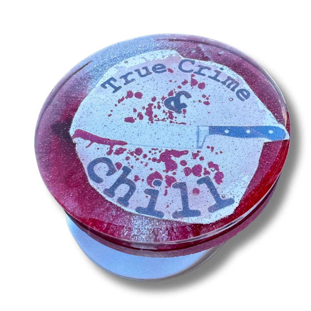 Poxy_Roses's tweet image. Obsessed with true crime? 🔪📺 Add some flair to your phone with this "True Crime &amp;amp; Chill" resin grip! Handmade and totally unique – perfect for crime junkies everywhere. 💀 #TrueCrime #ResinArt #CustomGrip #ShopSmall #CrimeJunkie #Handmade buff.ly/4feJlTo