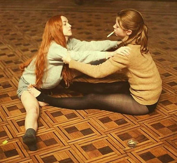 Dakota Johnson and Mia Goth on the set of Suspiria, 2018