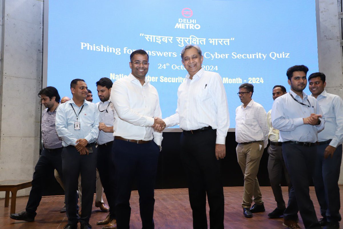 OfficialDMRC's tweet photo. DMRC organised a quiz competition for employees titled “Phishing for Answers: The Cyber Security Quiz” on Thursday to raise cyber security awareness among employees. 

DMRC's MD Dr. Vikas Kumar attended the event and presented prizes to the winners. Rashid Jamil and Saquib Mustafa won the first prize.