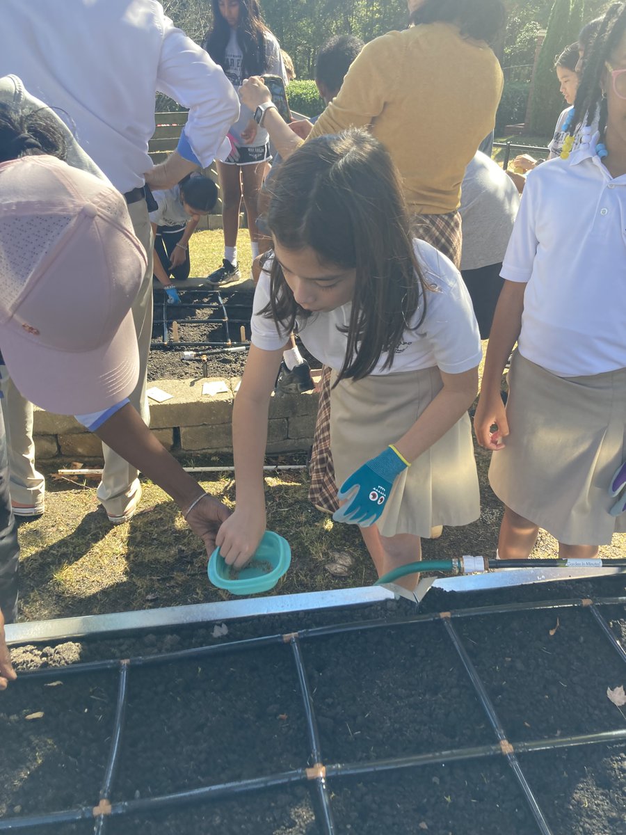 WN 1st and 2nd graders plant spinach in the new garden!!  <a href="/WoodwardAcademy/">Woodward Academy</a> <a href="/namburar/">Viji Namburar</a>