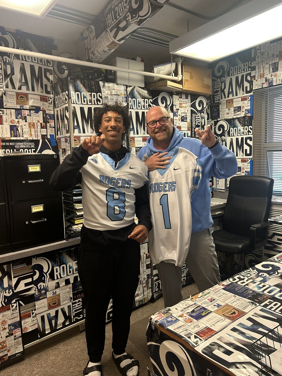 RogersRamsFB's tweet photo. This weeks #1 Jersey goes to our AD Mr. Collins. Being the #1 actually is fitting because of the work that he does each day with all the sports teams at Roger’s. He’s always there lending a voice at home games and can see him on the sidelines at away games. #HoldItUp #NotFitting https://t.co/bUBSEAK034