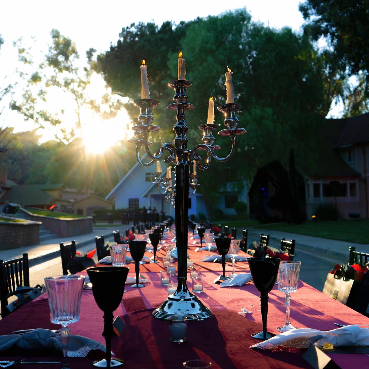 UniStudiosLot's tweet photo. This week, #ElmStreet came alive with a hauntingly beautiful dinner event for @gcdswear and Universal Monsters. Elegant candelabras and dark accent table settings added a touch of sophistication. It was a night filled with spooky delights! 🕯️🏘️ 🧛♂️ #UniLotEvents #OutdoorEvents https://t.co/lgGSgbARLa