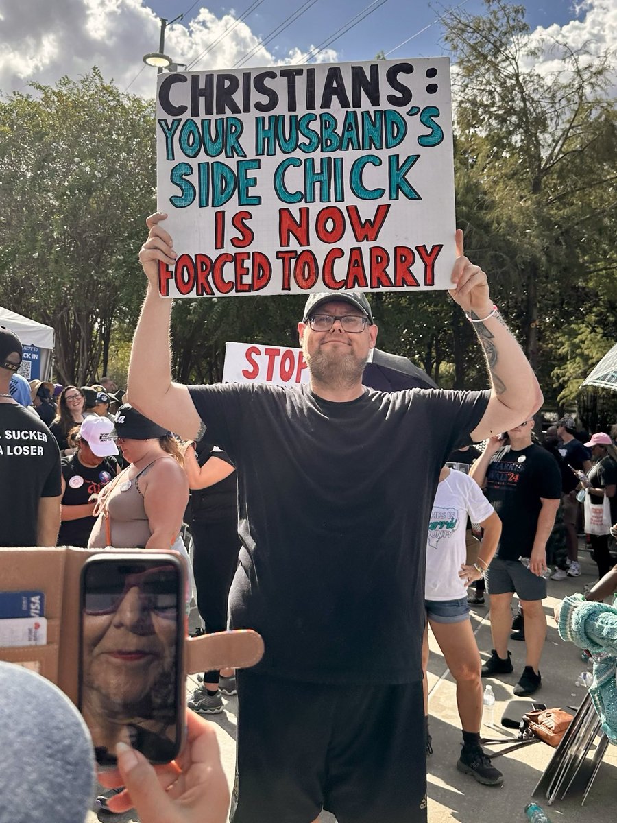 Love this from the Houston rally… Especially granny taking a picture while smiling 🤣🤣
