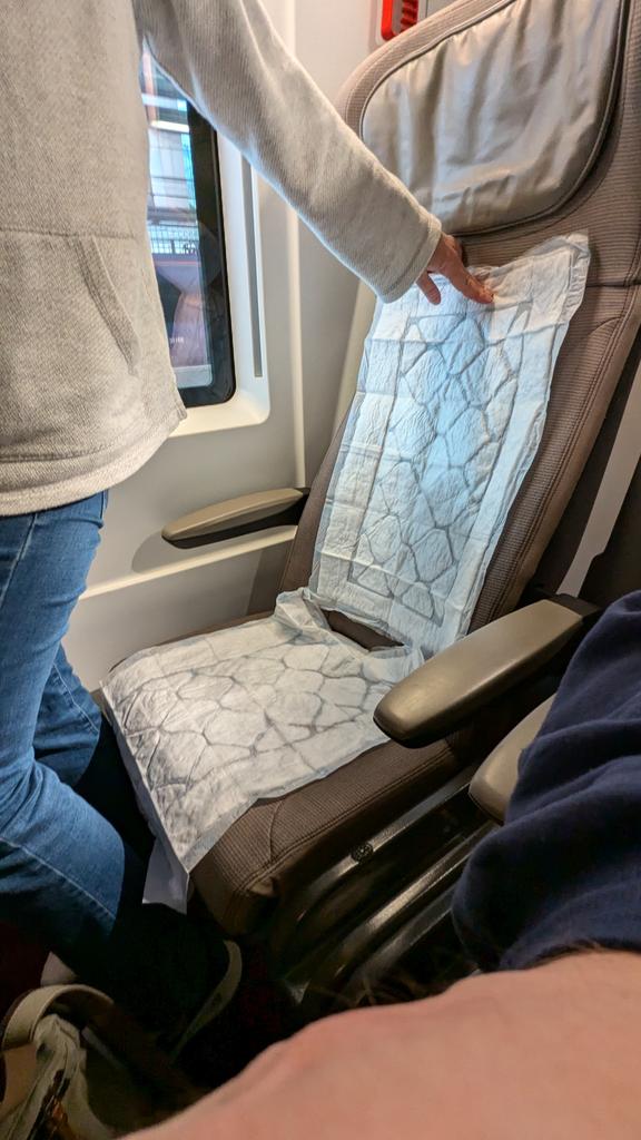 _adept_'s tweet photo. @EurostarUK @EurostarUK likes to get out asses wet! Our saga on board of 11:04 train 9126 to Brussels continues. Seats we were moved to have "don't seat on me, I am waiting to be cleaned" stickers, and they are quite wet.  No other seats available, and we are given nappies to cover them. https://t.co/l2gOYjIKb5