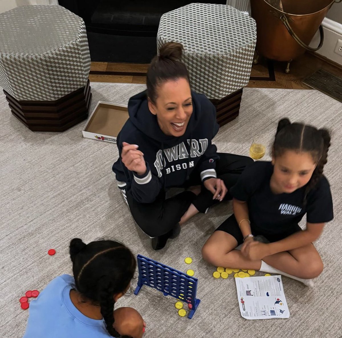 Kamala Harris is still the joyful queen, playing connect 4 with her great-nieces in her Howard sweatshirt. Love this for her!