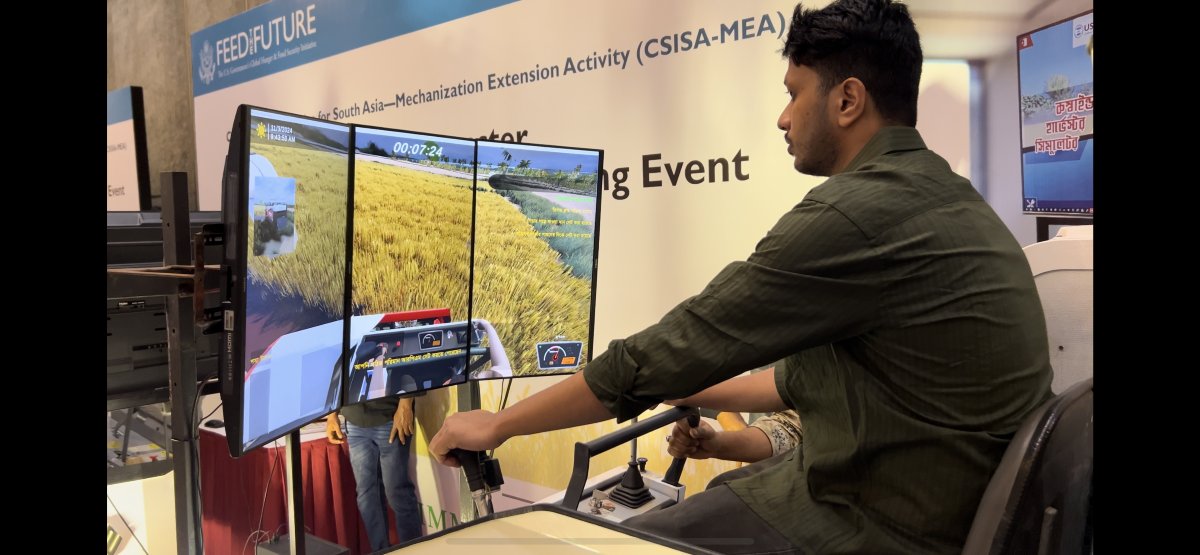 CIMMYT's tweet photo. 🚜Bangladesh steps into a new era of agri-training! The first Combine Harvester Simulator brings safe, advanced training to Dhaka. This CIMMYt-led initiative with Metal Agritech & Abedin Equipments boosts skilled operators & attracts young entrepreneurs🌾#CSISA @USAID @USAID_BD https://t.co/tb9TOmsqsx