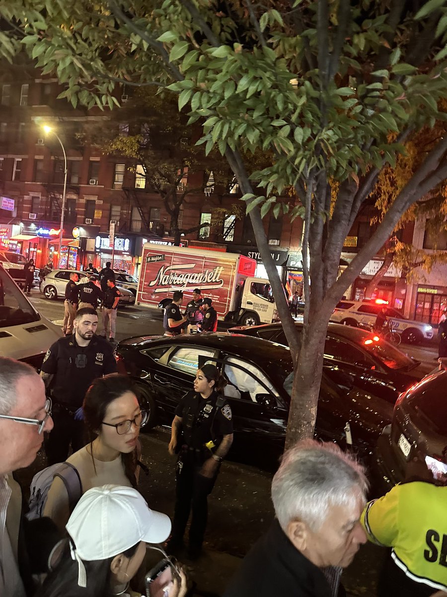 SeanLavin's tweet photo. #BreakingNews in #NYC: #NYPD all over Ninth Ave in #HellsKitchen. Witnesses say a #policechase started north of this spot, up by Empanada Mama. The car took off and then they heard a loud bang. Crowd said a woman was taken from the car. Crowded street where people dine outside. https://t.co/6Dc5TKu3H8