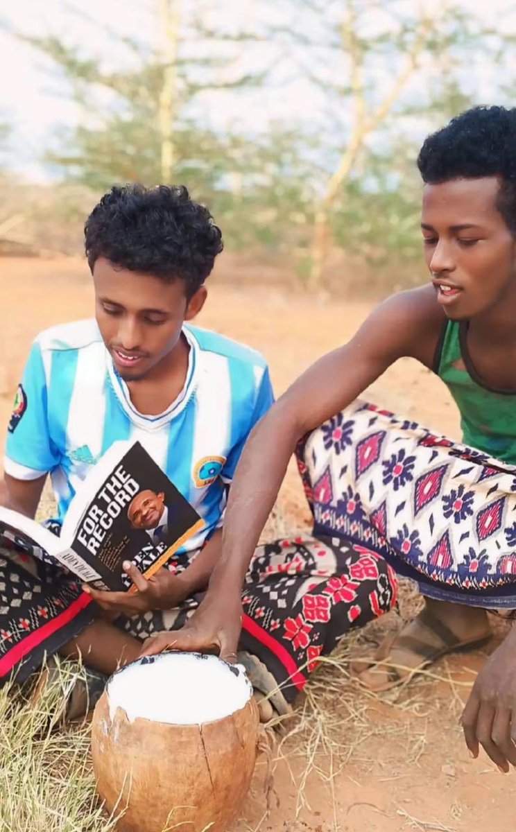 HonAdenDuale's tweet photo. Youngsters in Dertu village in Garissa county with a copy of “For The Record -The Inside Story of Power, Politics, Lawmaking &amp; Leadership in Kenya “ next to a bowl of camel milk.Guul https://t.co/XntpQFGe8Y