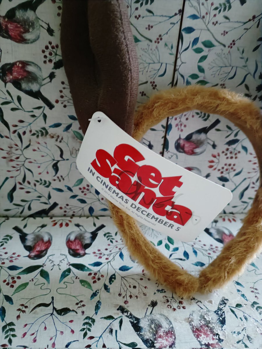 AttheflicksPod's tweet photo. 100 Movie Tie In Items. No. 99 Get Santa reindeer ears. Check it carefully and you can see this is one tie in that is signed by the movie's director. Won't be long before we start the annual At The Flicks advent calendar which has some exciting new entries. #GetSanta https://t.co/IdCFpYoCKL